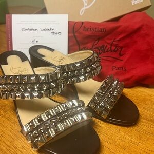 Christian LouBoutin black with silver studs.  In great shape. Very sexy shoes!